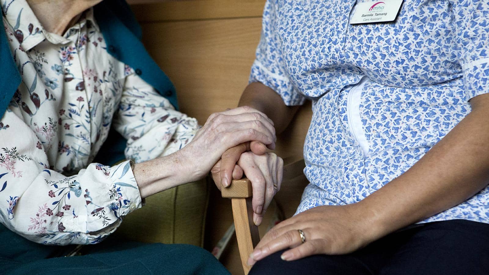 Riverview Lodge - resident & Care Assistant holding hands