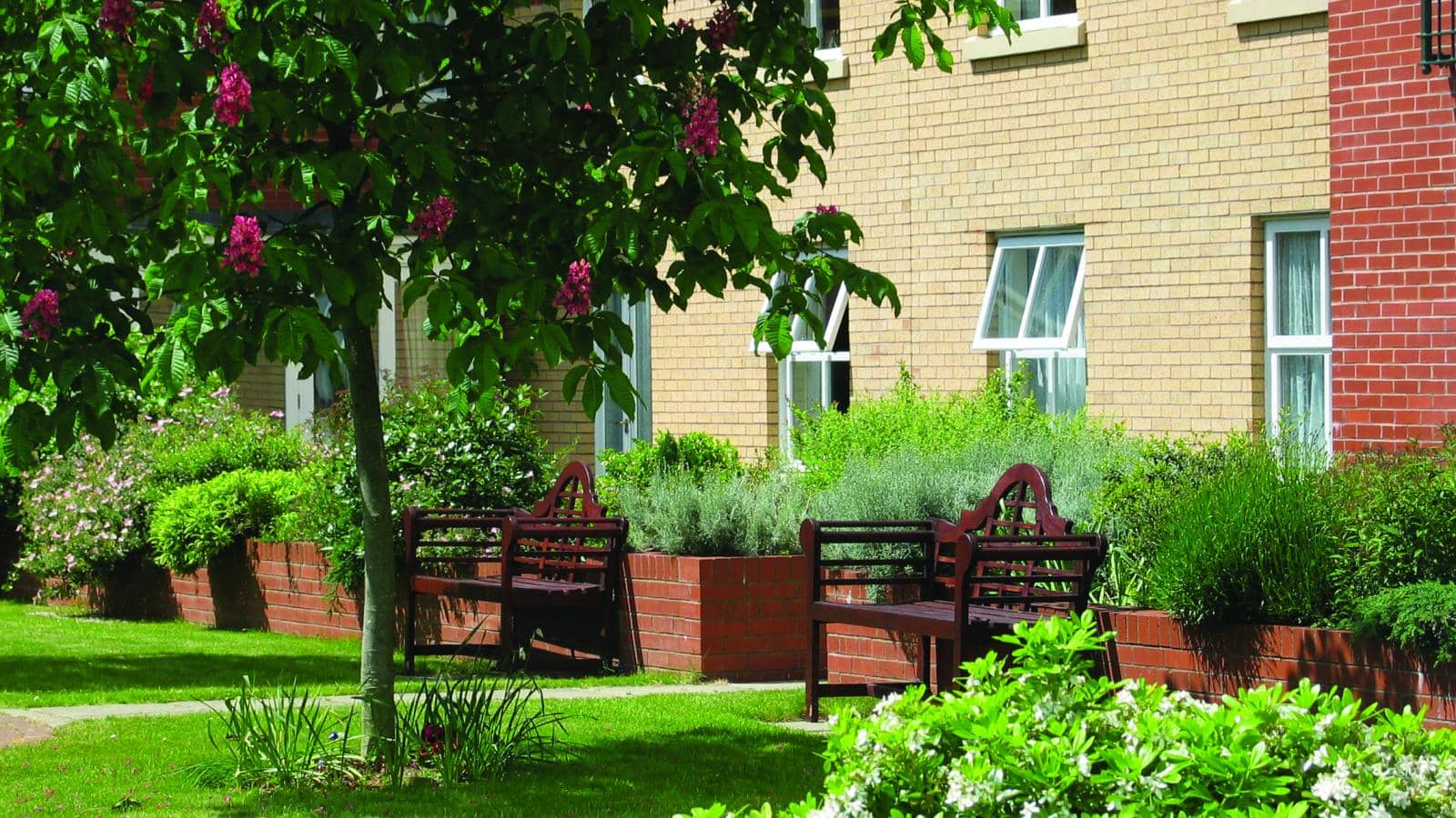 MHA Nora Bellot Court retirement living gardens and benches