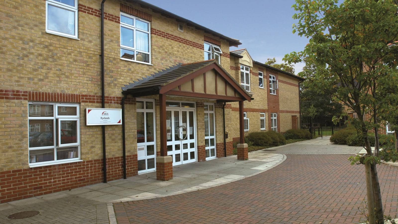 The entrance and reception of Ryelands care home from the car park