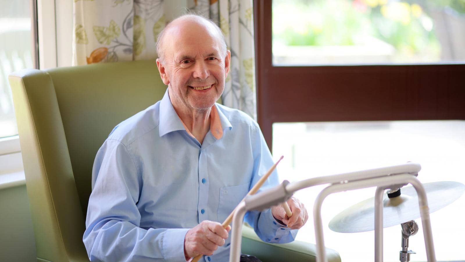 Music Therapy at an MHA care home with drumsticks