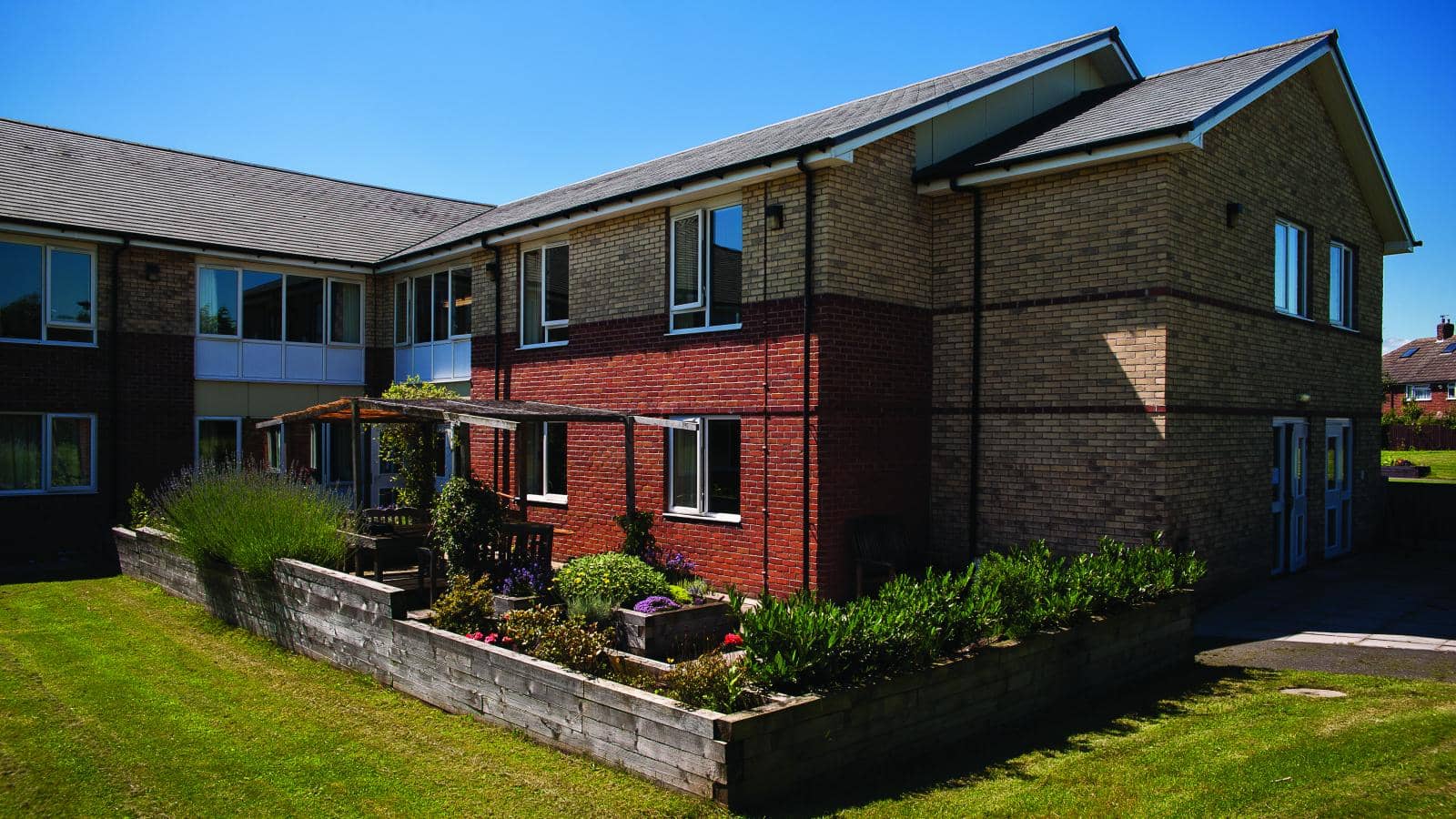 MHA Waterside House care home gardens and raised flower beds