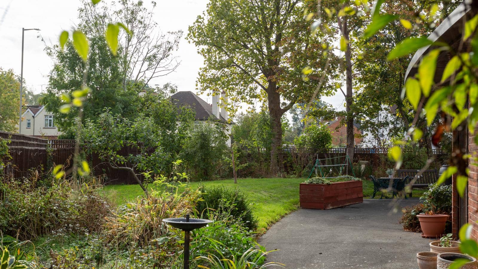 Gardens and lawns of Westbury Grange care home on a grey and cloudy day