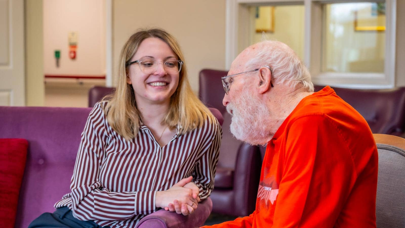 Woman speaking with older person