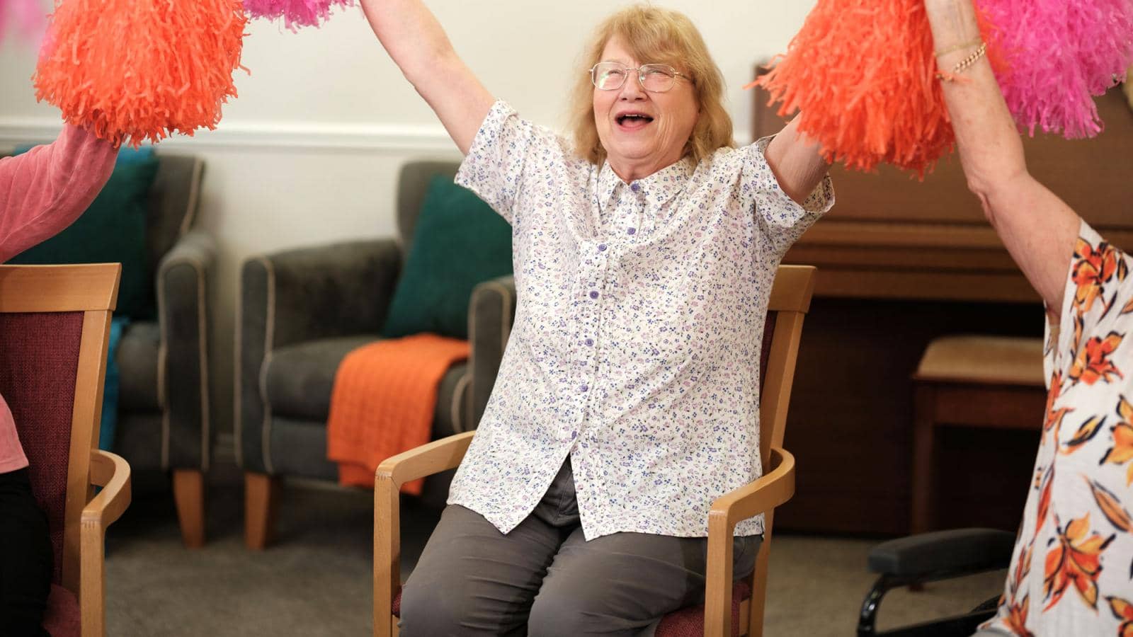 woman waving pom poms