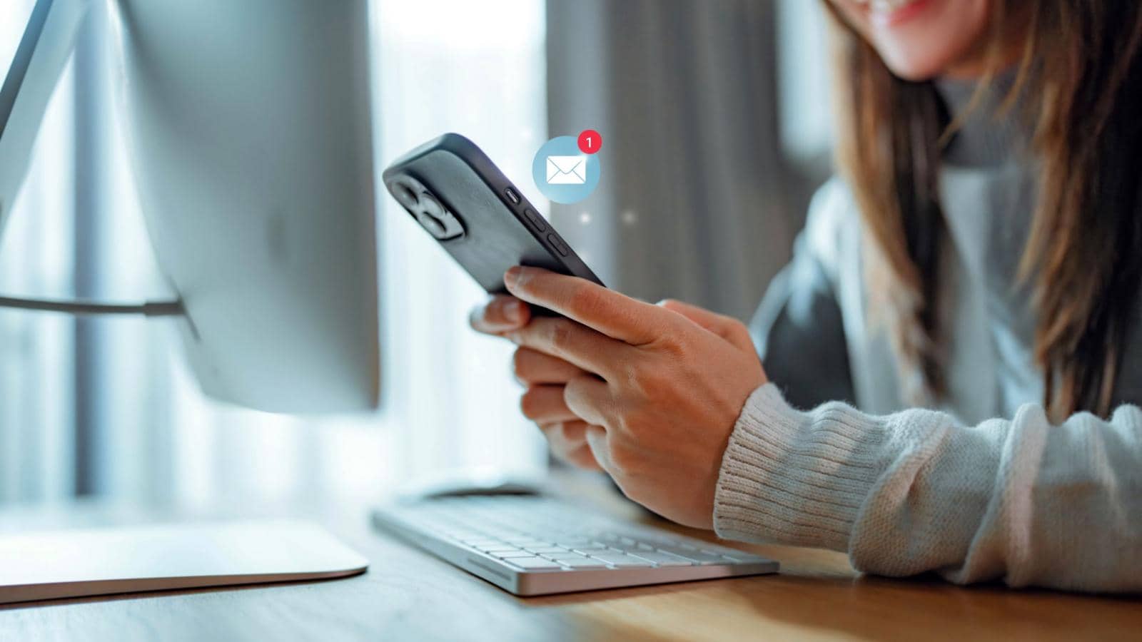 Woman hands using smartphone with 1 new email alert sign icon pop up