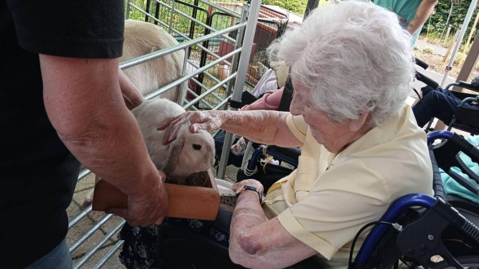 A resident at MHA The Fairways with one of the animals