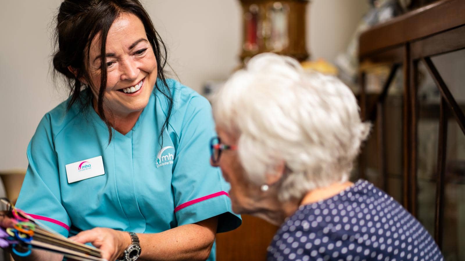 Caring Nurse Engaging with Elderly Patient