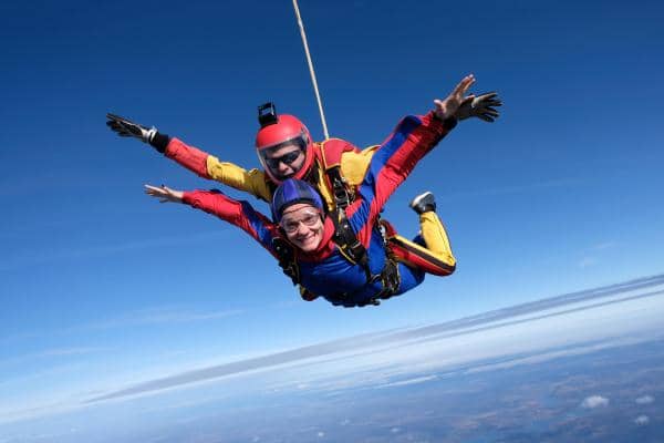 man and woman skydiving