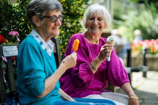 Joyful Seniors Enjoying Ice Cream on a Sunny Day