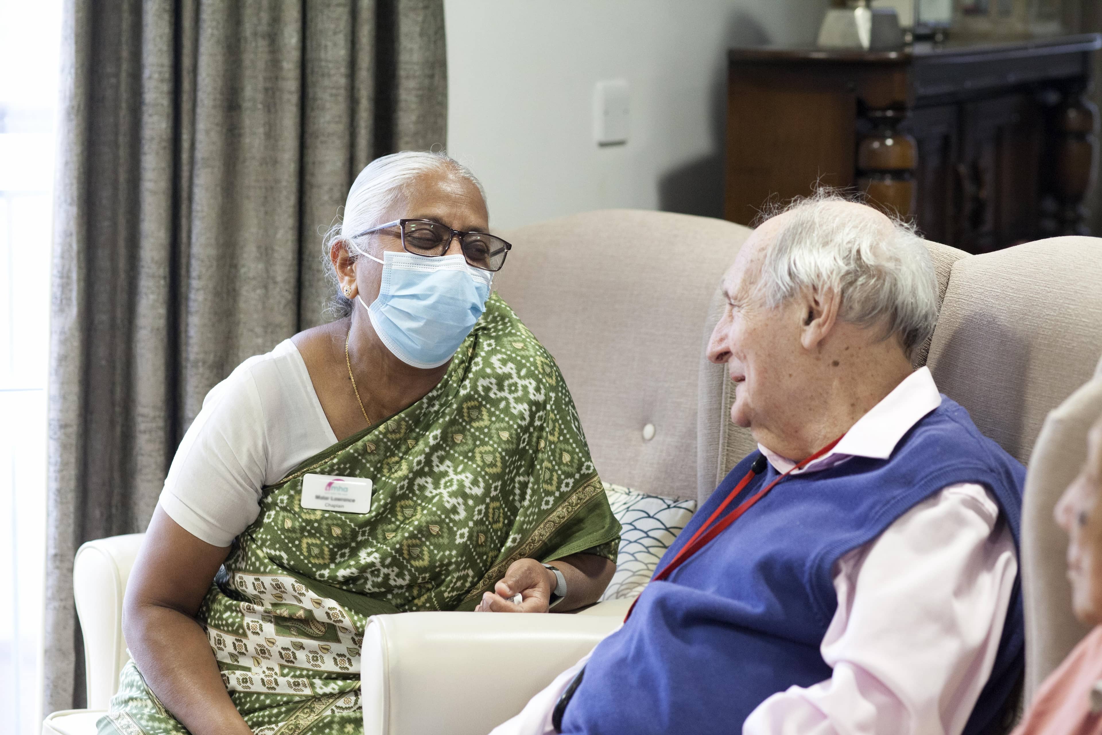 Chaplain and male resident talking