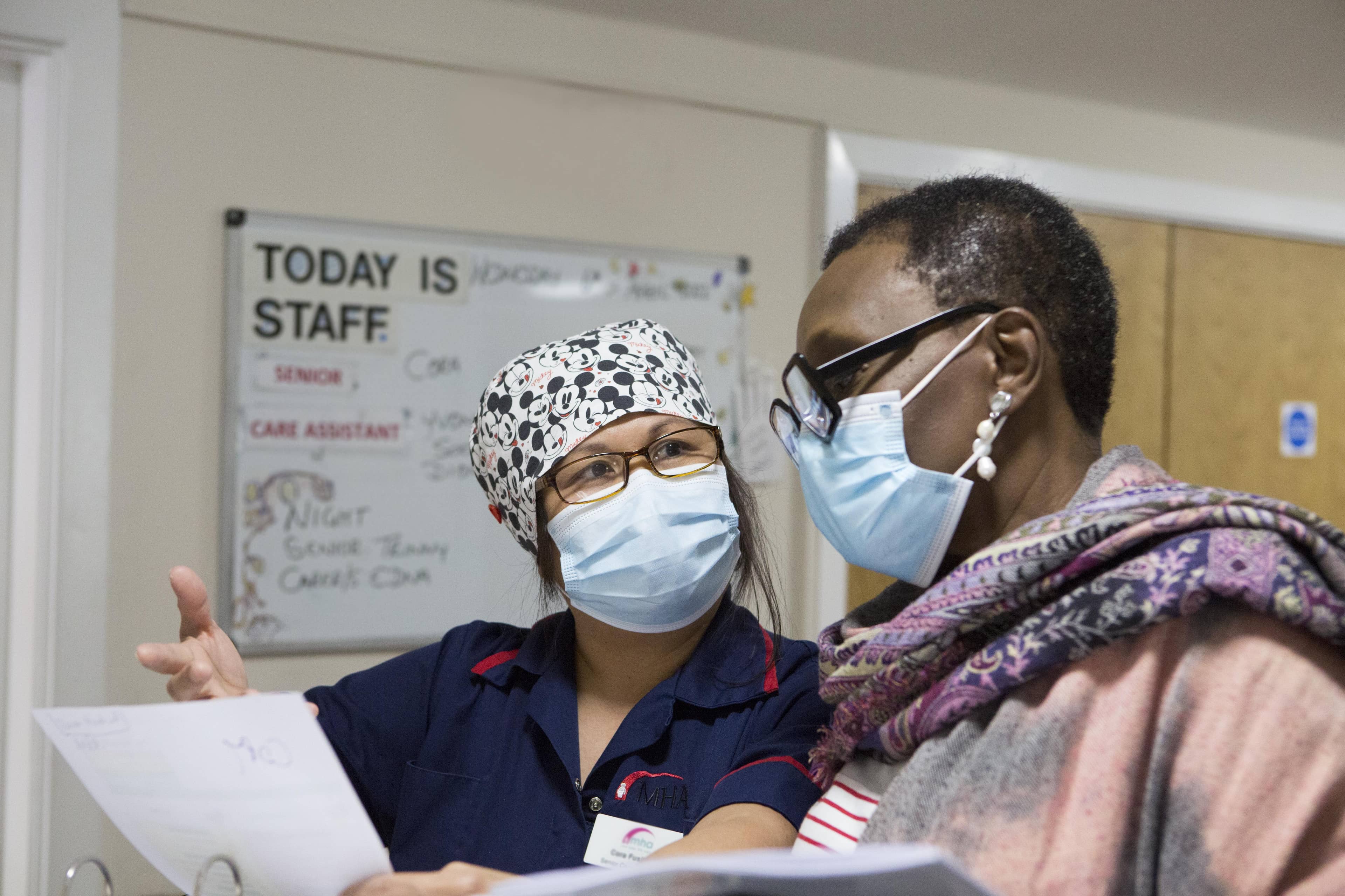 Chaplain talking with nurse