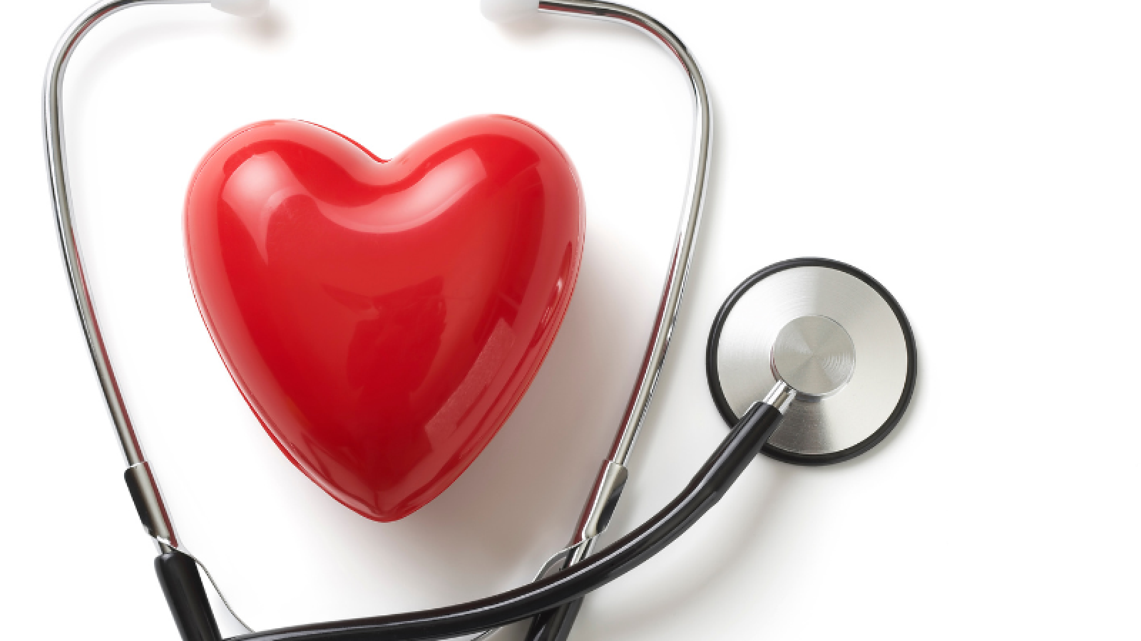 A stethoscope surrounds a red heart. 