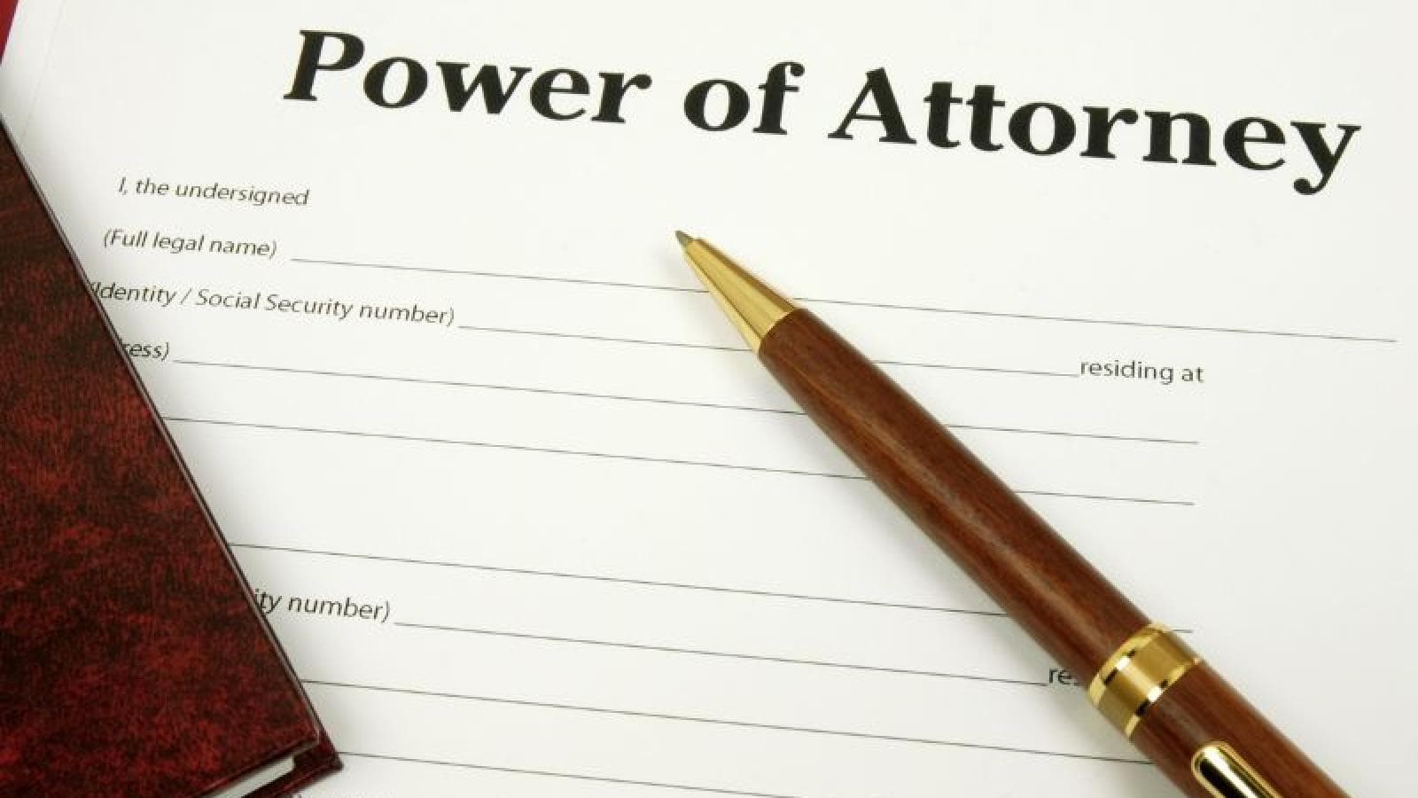 Power of Attorney document and a pen