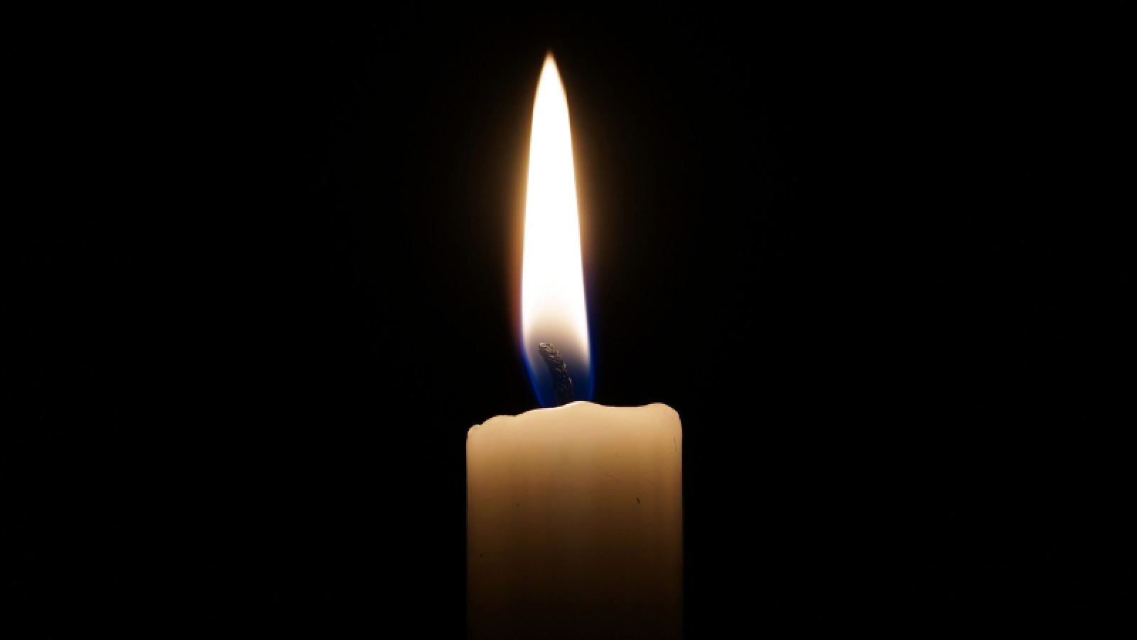 Candle burns in the dark 