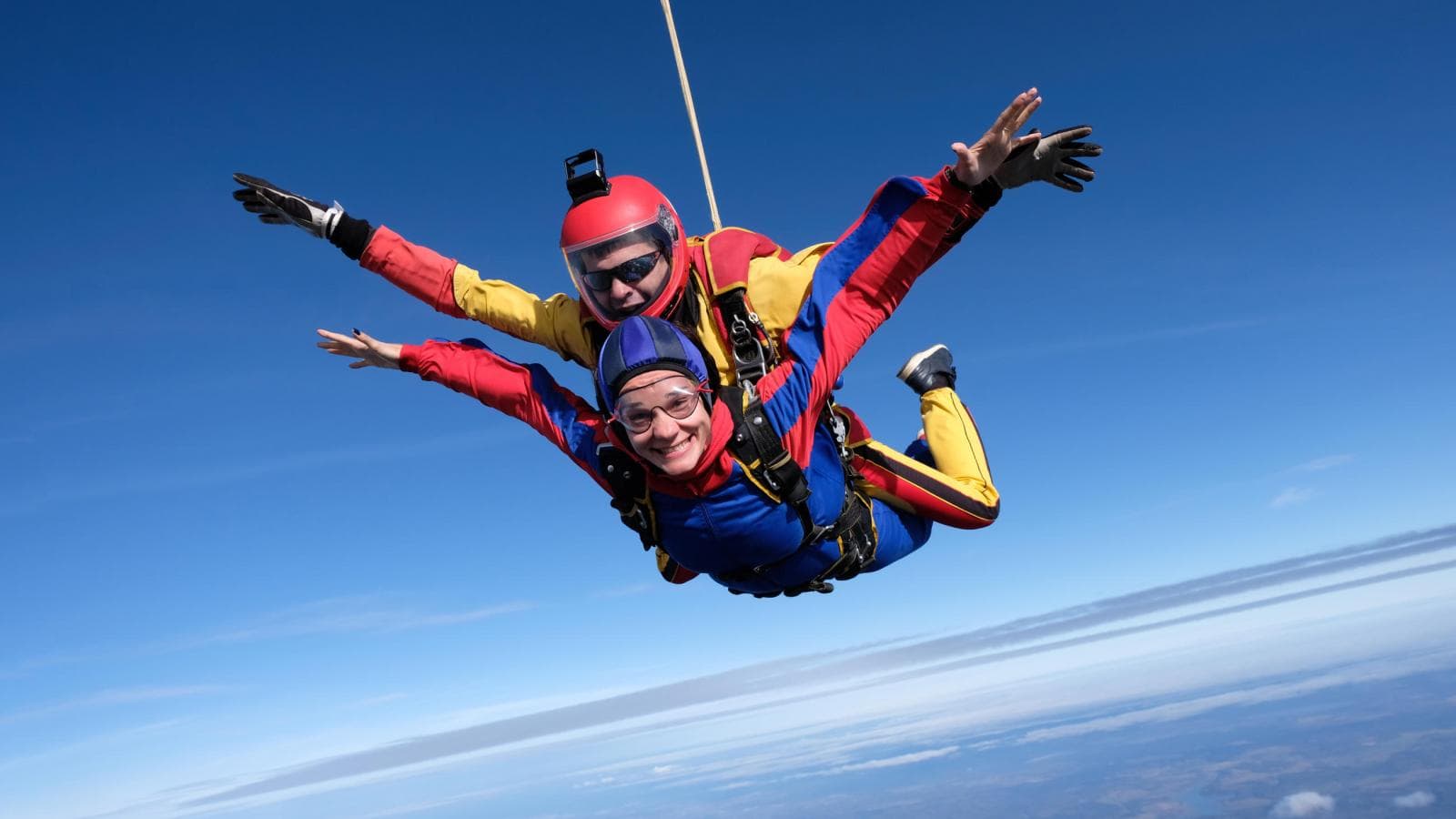 man and woman skydiving
