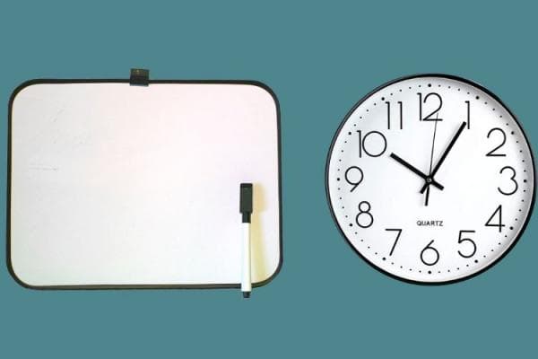 A whiteboard and a clock